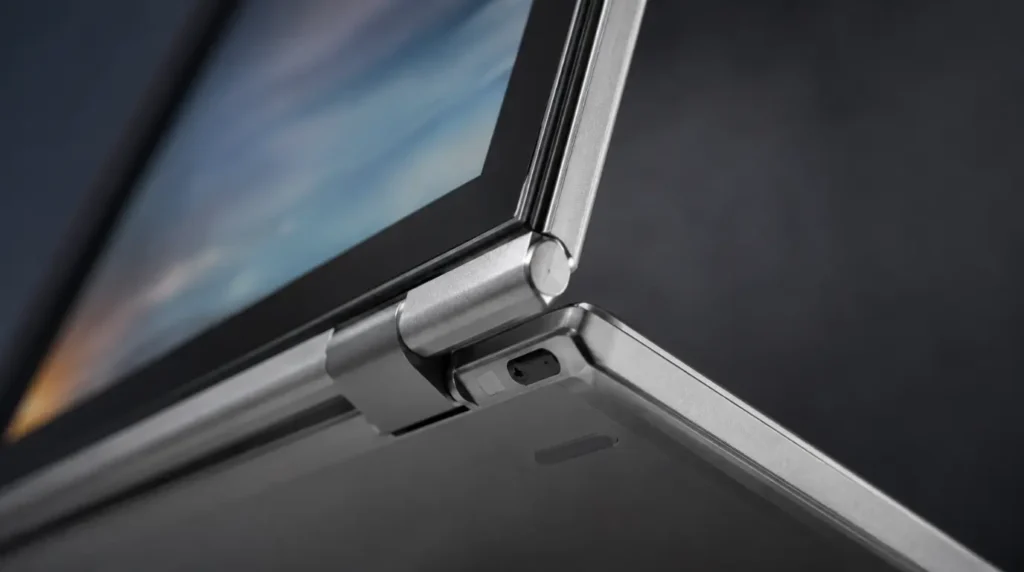 Close-up of Chromebook 360-degree hinge in tablet mode showing the rotation sensor area